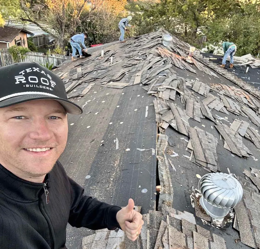 Professional roof shingle installation close-up